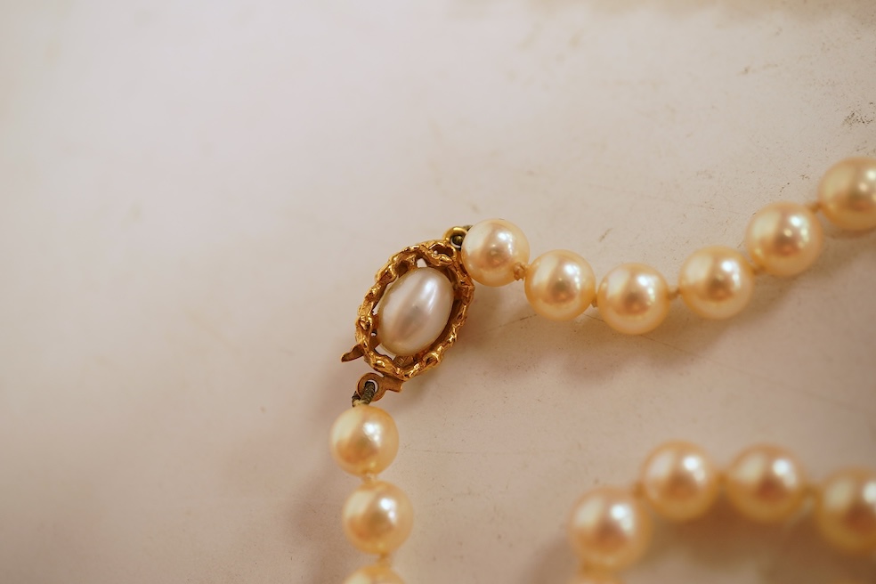 Two cultured pearl necklaces, each composed of a single row of cultured pearls, one with pearls 3-7mm diameter, length 44cm, clasp stamped 9CT; the other with pearls approximately 6mm diameter, length 86cm, clasp with Br